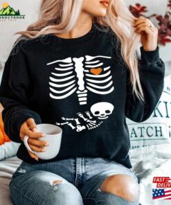 Skeleton Halloween Maternity Sweatshirt Funny Pregnancy Announcement Shirt 2023 Pregnant Women Costume Hoodie 3 Skeleton Halloween Maternity Sweatshirt Funny Pregnancy Announcement Shirt 2023 Pregnant Women Costume Hoodie 4