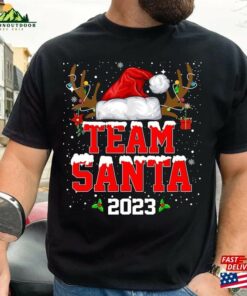 Team Santa 2023 Christmas Shirt Matching Family Reindeer Lights Unisex Hoodie