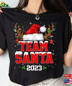 Team Santa 2023 Christmas Shirt Matching Family Reindeer Lights Unisex Hoodie 3 Team Santa 2023 Christmas Shirt Matching Family Reindeer Lights Unisex Hoodie 4