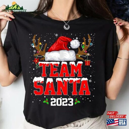 Team Santa 2023 Christmas Shirt Matching Family Reindeer Lights Unisex Hoodie